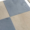 Alternating gray Bardiglio and beige Crema Marfil marble tiles in 18x18 checkerboard pattern