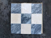 Nine Bardiglio Crema Marfil polished-honed mosaic tiles in checkerboard grid