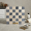 A polished-honed Checkerboard Bardiglio Crema Marfil marble mosaic tile panel with beige and dark gray squares