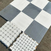 Assorted tile samples of Checkerboard Bardiglio Imperiale and Bianco Dolomite Marble
