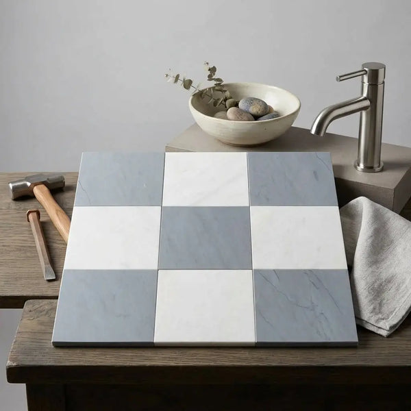 Square tiles checkerboard pattern of bardiglio imperiale and oriental white marble on wooden surface