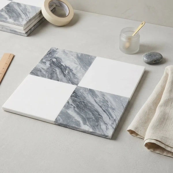 Square marble-patterned checkerboard bardiglio nuvolato and thassos tile set with gray white veining and solid sections