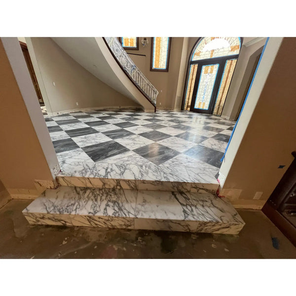 Checkerboard bardiglio nuvolato and italian statuary marble 18x18 black and white checkered floor with matching staircase