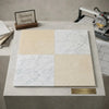Four square spanish marble tiles in creamy beige and white with subtle and delicate gray veining checkerboard design