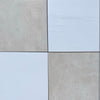 Four square tiles from the Checkerboard Bianco Dolomite and Crema Marfil 12X12 Set
