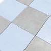 Checkerboard Bianco Dolomite and Crema Marfil 12X12 set with alternating light and dark tiles