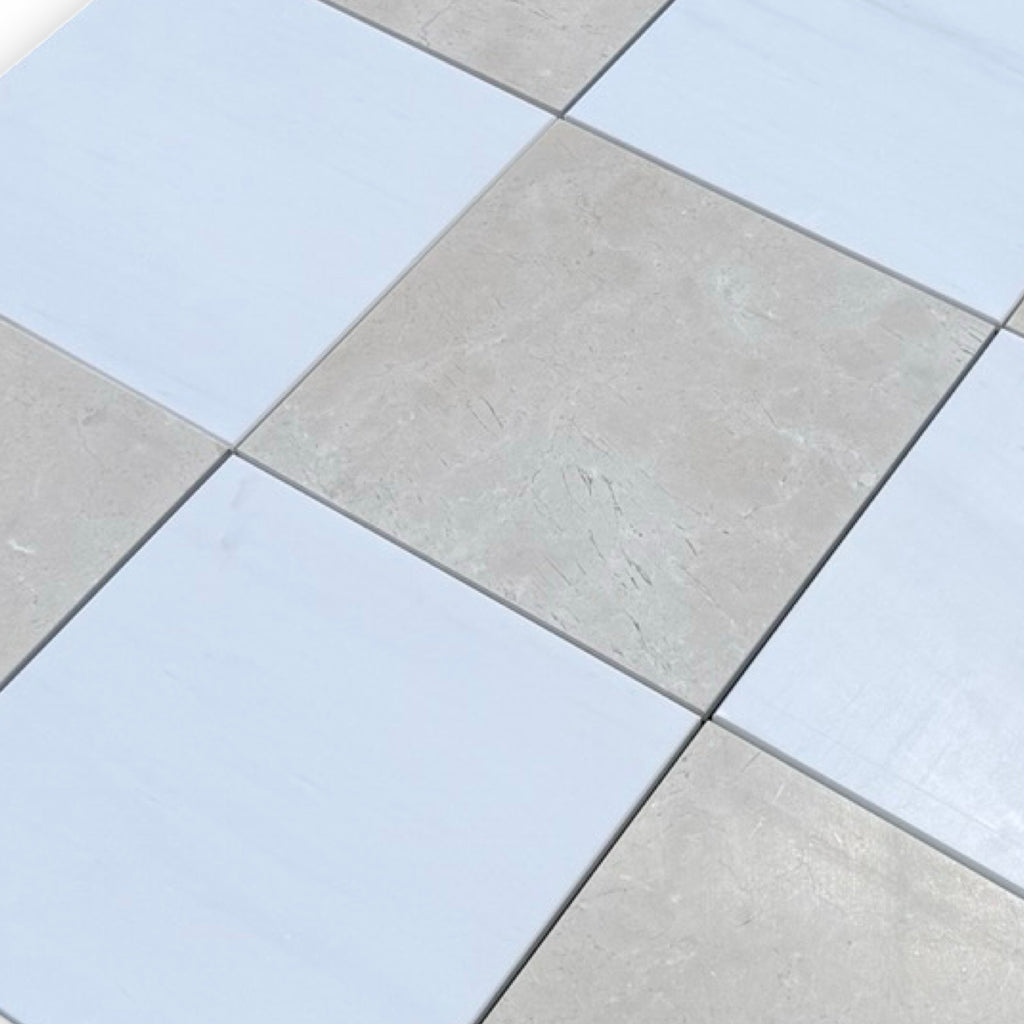 Checkerboard Bianco Dolomite and Crema Marfil 12X12 set with alternating light and dark tiles