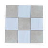 Checkerboard pattern with Nine Bianco Dolomite and Crema Marfil tiles in 12x12 set