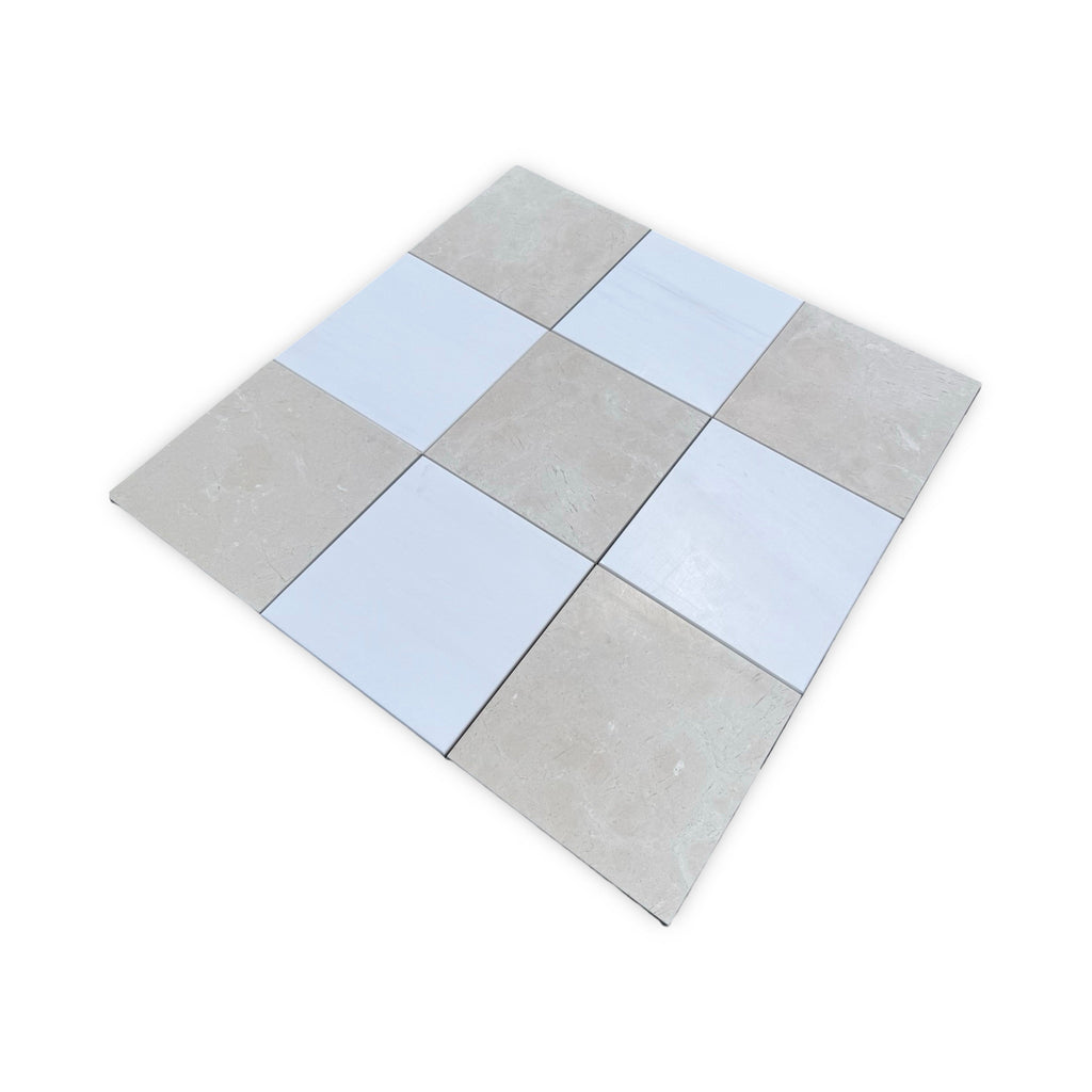 Checkerboard pattern of white Bianco Dolomite and Crema Marfil square tiles