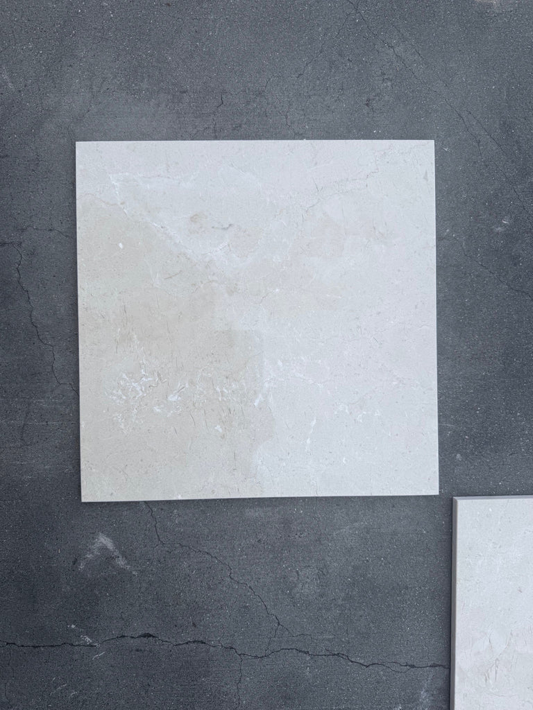 Square off-white tile from the Checkerboard Bianco Dolomite and Crema Marfil 12x12 Set