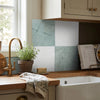 Kitchen backsplash of checkerboard bianco dolomite and ming green 12x12 set with teal and white marble-like tiles