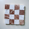 Checkerboard pattern of white Carrara marble and reddish-brown Rojo Alicante tiles