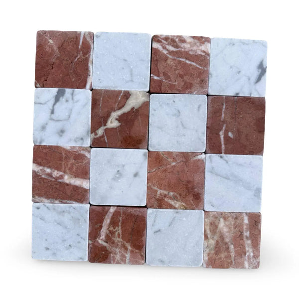 Checkerboard pattern of red and white marble tiles from Checkerboard Carrara White Rojo Alicante collection