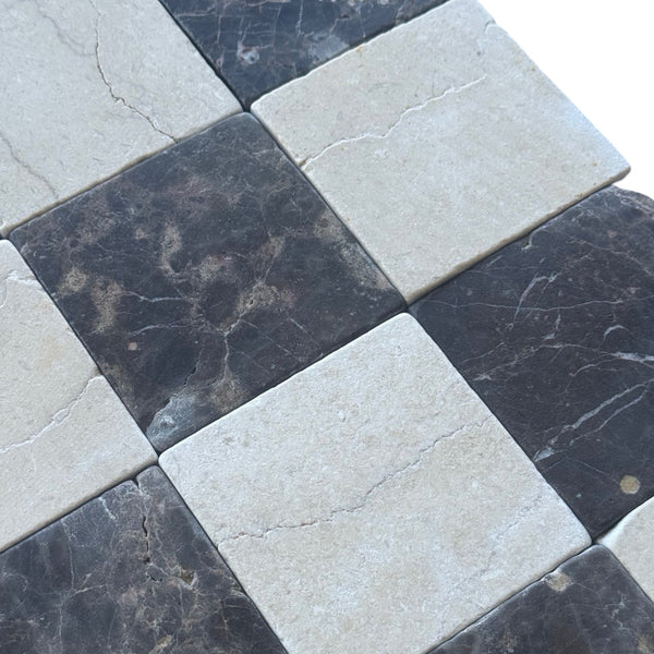 Checkerboard marble tiles in Crema Marfil and Emperador Dark Tumbled Set display