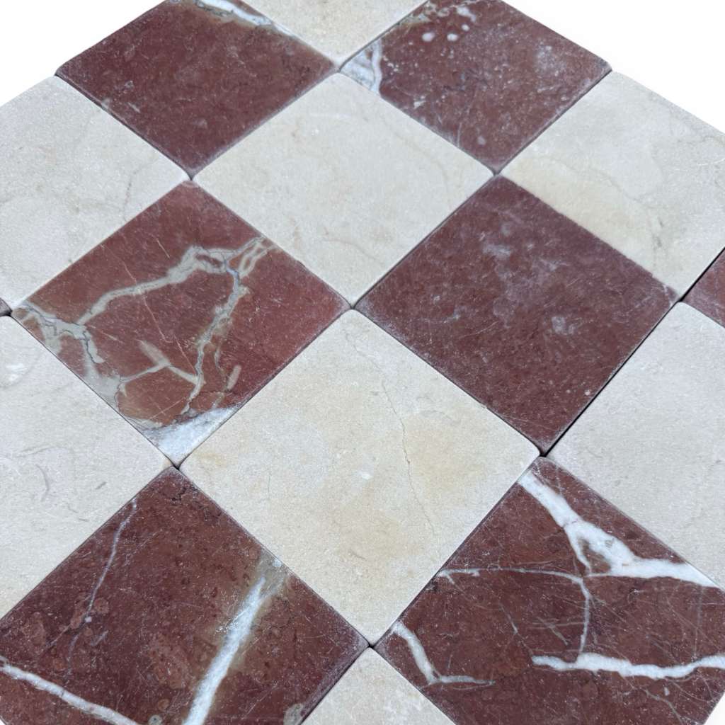 Checkerboard Crema Marfil and Rojo Alicante marble tiles with natural veining pattern