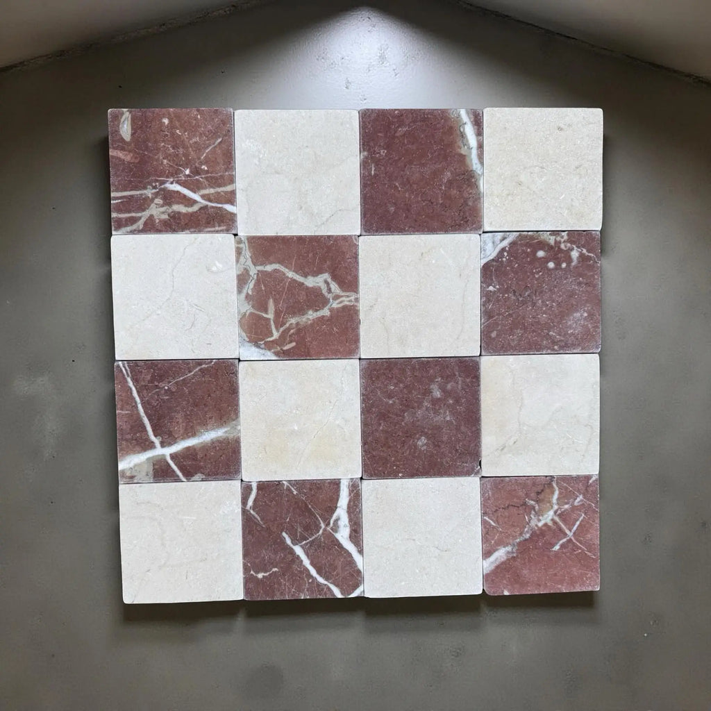 Checkerboard pattern of red and white marbled tiles in Checkerboard Crema Marfil Rojo Alicante 4X4 Tumbled