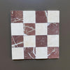 Checkerboard pattern of Red Alicante and Crema Marfil marble tiles in 4x4 tumbled finish
