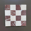 Checkerboard pattern of Red Alicante and Crema Marfil marble tiles in 4x4 tumbled finish