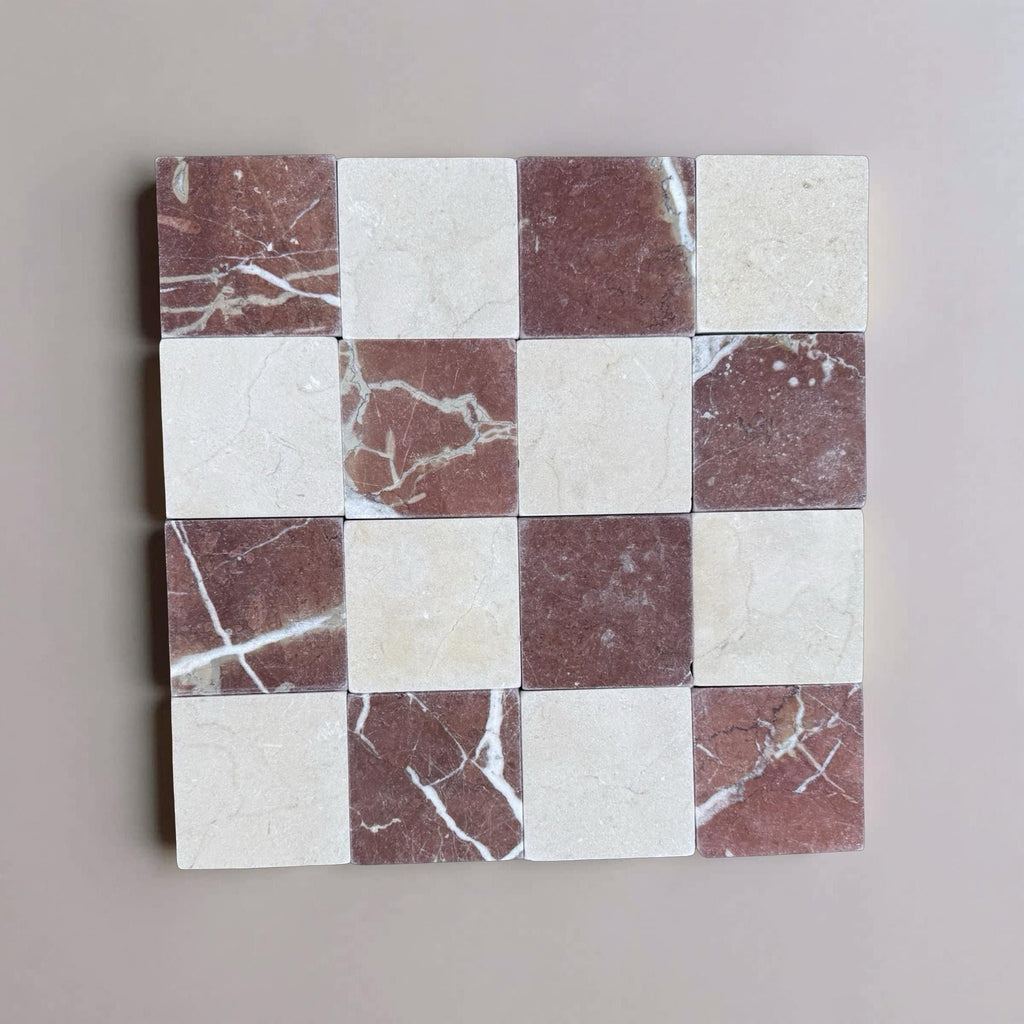 Checkerboard pattern of Crema Marfil and Rojo Alicante marble tiles in 4x4 tumbled finish