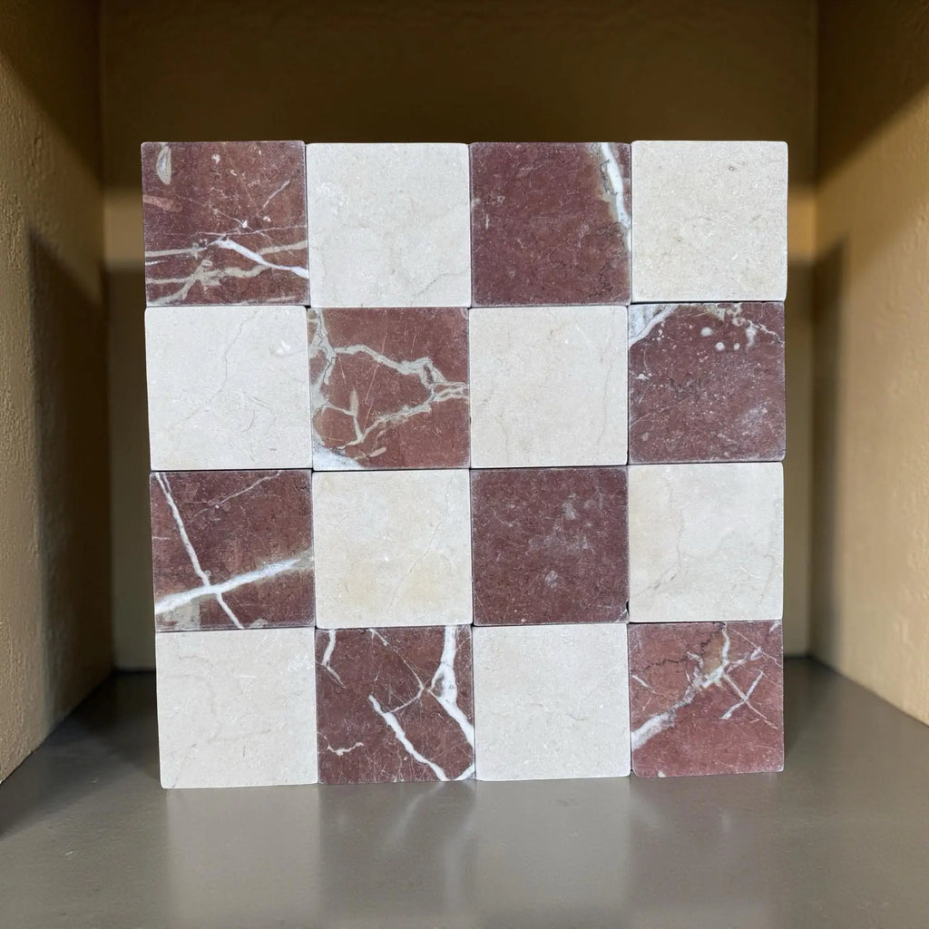 Checkerboard pattern of Cremamarfil and Rojo Alicante marble tiles in cream and reddish-brown hues
