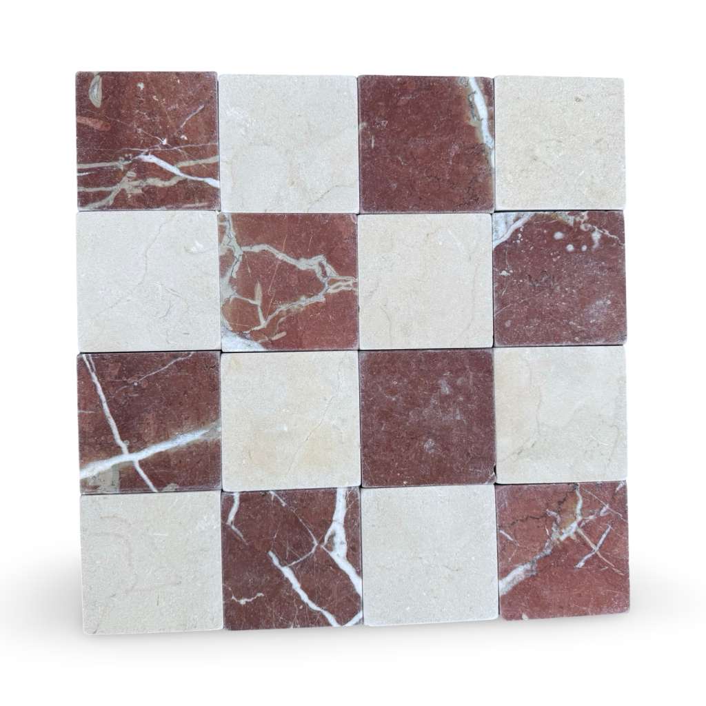 Checkerboard pattern of Crema Marfil and Rojo Alicante marble tiles in a tumbled finish