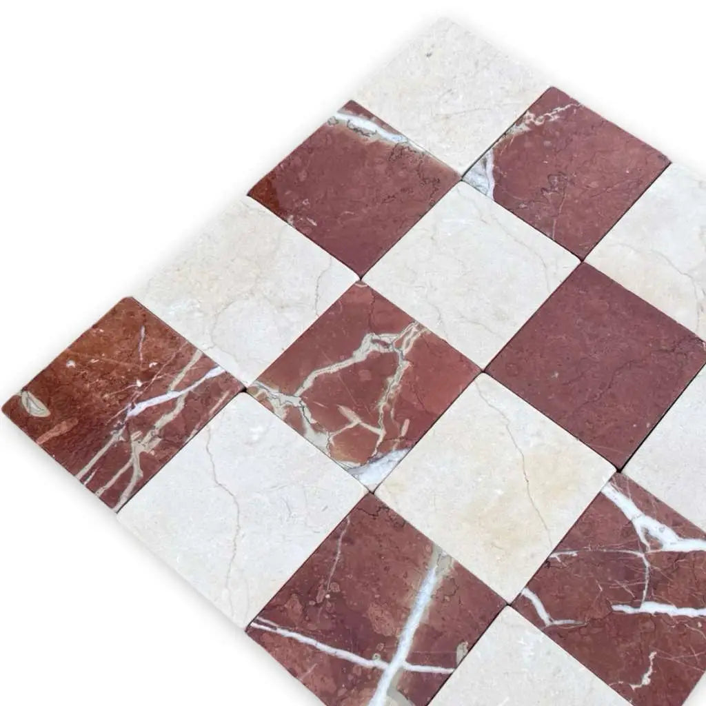 Checkerboard Crema Marfil and Rojo Alicante marble tiles in red and white tumbled pattern