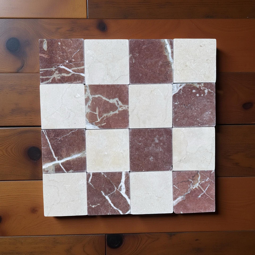 Checkerboard pattern of polished Crema Marfil and Rojo Alicante marble tiles