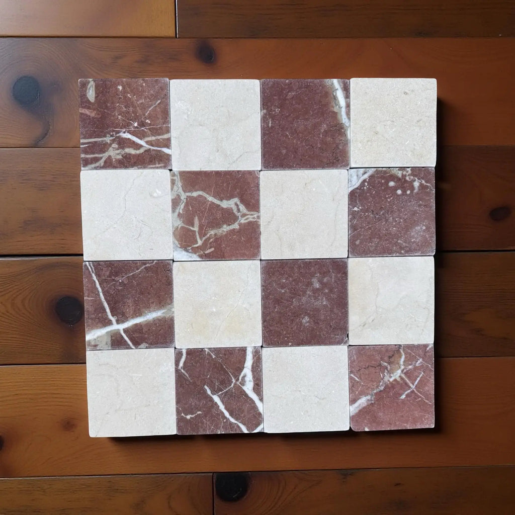 Checkerboard pattern of polished Crema Marfil and Rojo Alicante marble tiles