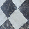 Checkerboard Emperador Dark and Crema Marfil marble tiles in a 6x6 tumbled set