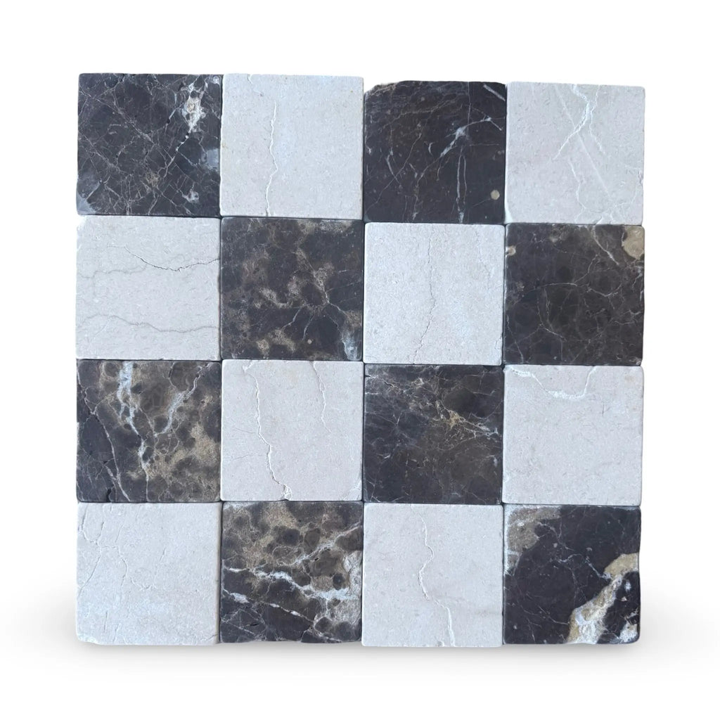 Checkerboard pattern of Emperador Dark marble and Crema Marfil tumbled tiles