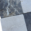 Set of four square stone tiles in Emperador Dark and Crema Marfil Tumbled finish