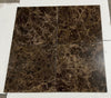 Four square brown Emperador Dark marble tiles with golden veining