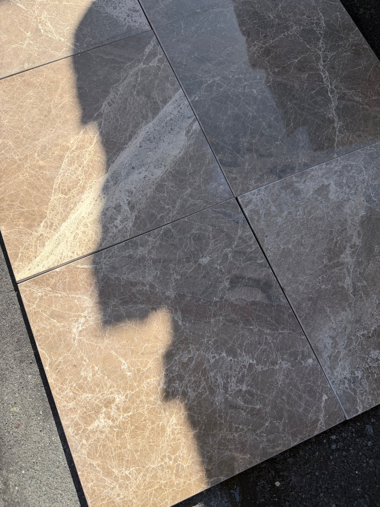 Shiny gray and beige Emperador marble 12x12 checkerboard tiles with veining
