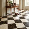 Dark and light checkerboard Emperador dark marble and Diano Royal marble tiles in 12x12 classic floor pattern