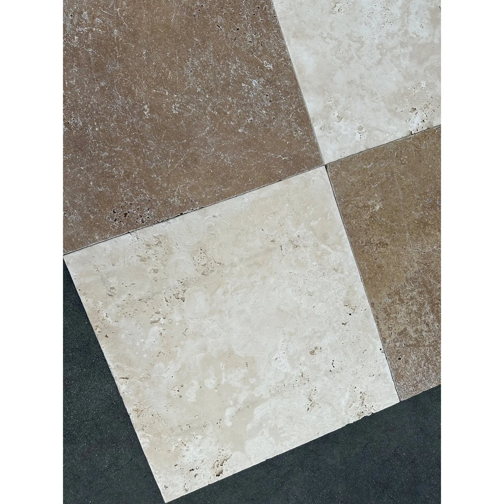 Square travertine tiles from Checkerboard Ivory and Noce set in 18x18 inches