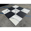 Black and white checkered Nero Marquina and Arabescato Corchia marble tiles