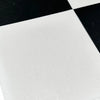 White glittery fabric coaster on Checkerboard Nero Marquina and Thassos White Marble 18x18 set