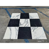 Black and white Nero Marquina and Arabescato Corchia marble checkerboard pattern setting