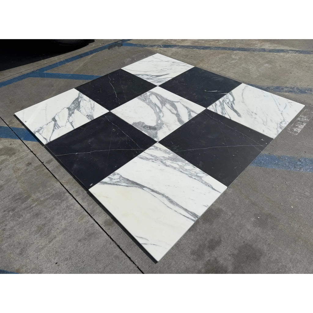 Black and white checkered Nero Marquina and Arabescato Corchia marble tiles