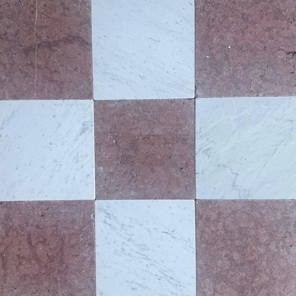 Checkerboard marble tiles from the Checkerboard Rojo Alicante and Carrara White 12x12 Tumbled Set