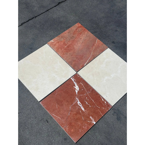 Four square marble tiles from Checkerboard Rojo Alicante and Crema Marfil set