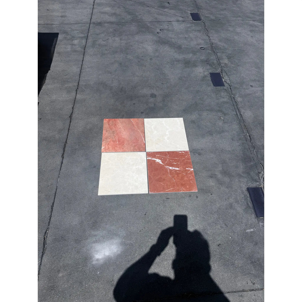 Four square marble tiles from the Checkerboard Rojo Alicante and Crema Marfil Marble 12X12 Set