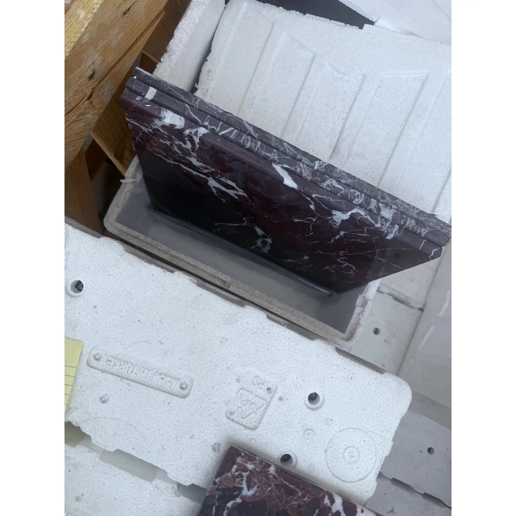 Maroon marble countertop piece from Checkerboard Rosso Levanto and Crema Marfil 12X12 Set