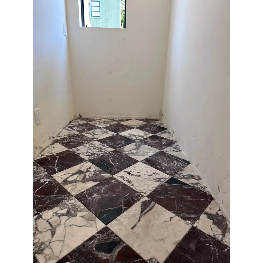 The floor features checkerboard rosso levanto and calacatta viola imperiale 12x12 tiles in a diamond-patterned marble design