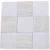 Nine white and light grey polished tiles with subtle veining in a checkerboard pattern