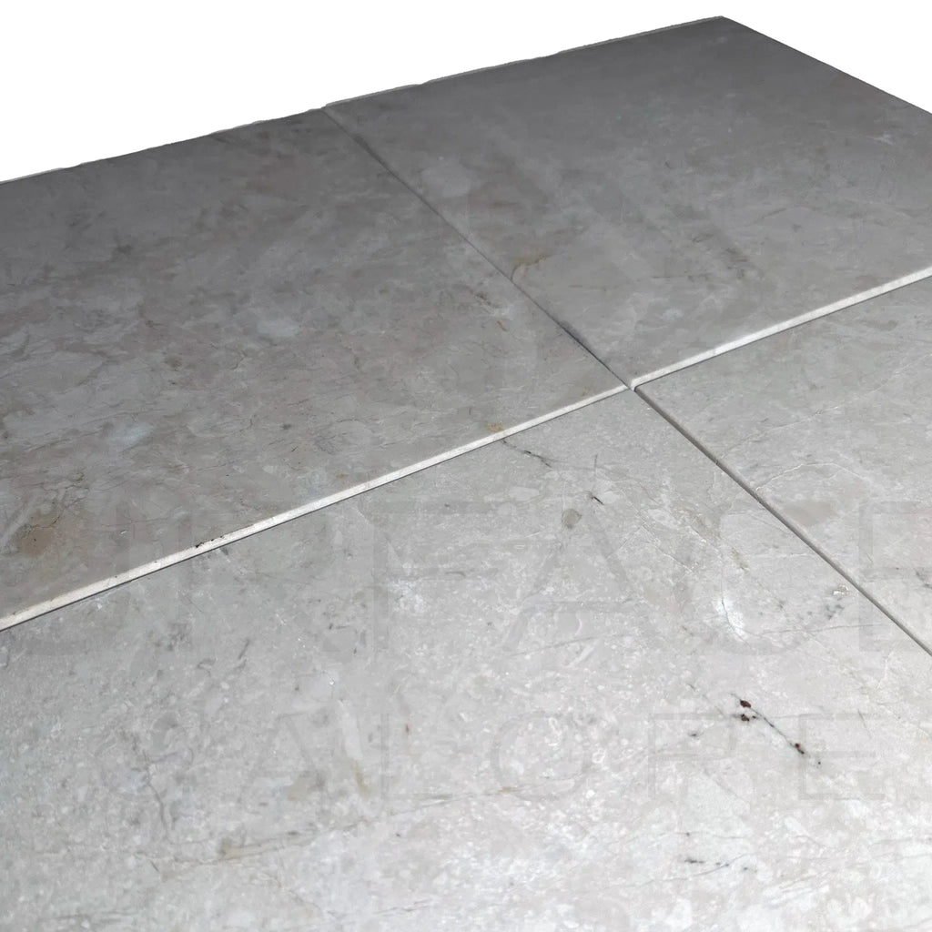 Gray marble floor tiles displayed in Classic Beige/White Marble 12X12 Polished Tile