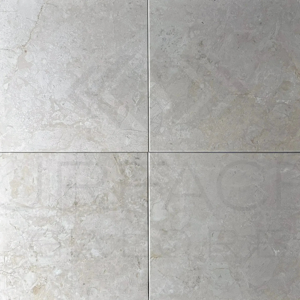 Four light gray marble tiles from Classic Beige White Marble Polished Tile collection