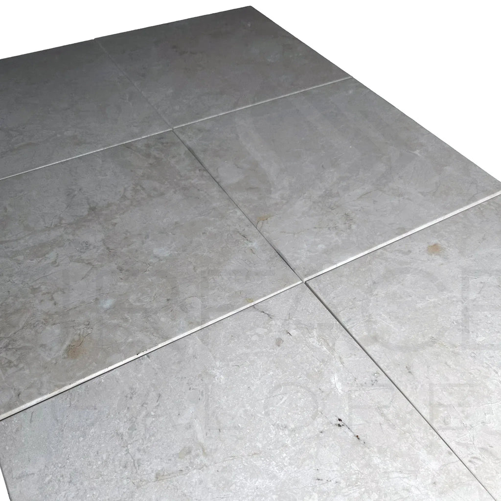 Gray marble floor tiles showcased in Classic Beige White Marble polished tile product