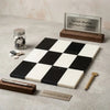 Black and white turkish marble checkered board featuring como in bianco dolomite 6x12 and nero marquina 6x12 set