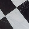 Black and white checkered marble tiles from Como in Carrara White and Nero Marquina set